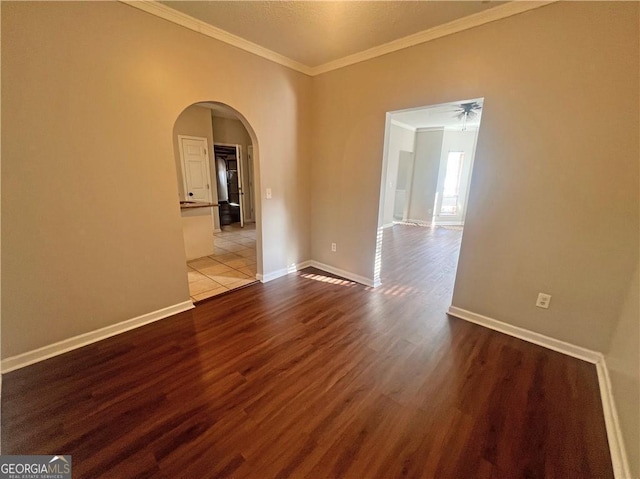 unfurnished room featuring ornamental molding, ceiling fan, and light hardwood / wood-style flooring