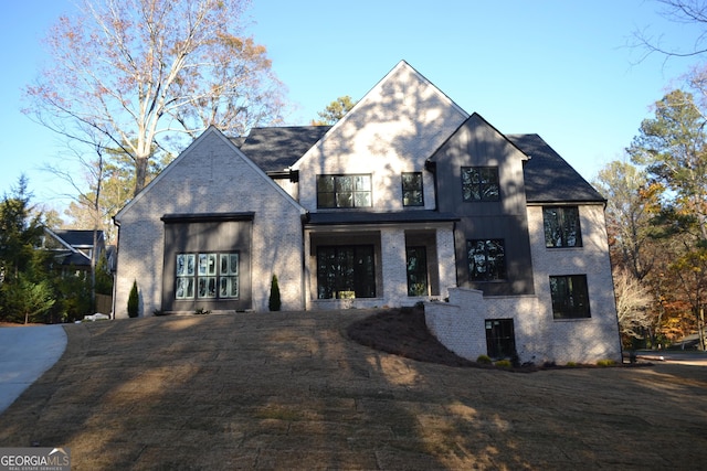 view of front of house featuring a balcony