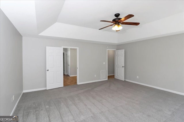 unfurnished bedroom with ceiling fan and carpet