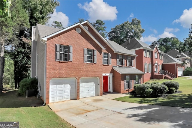 view of front facade with a front yard and a garage