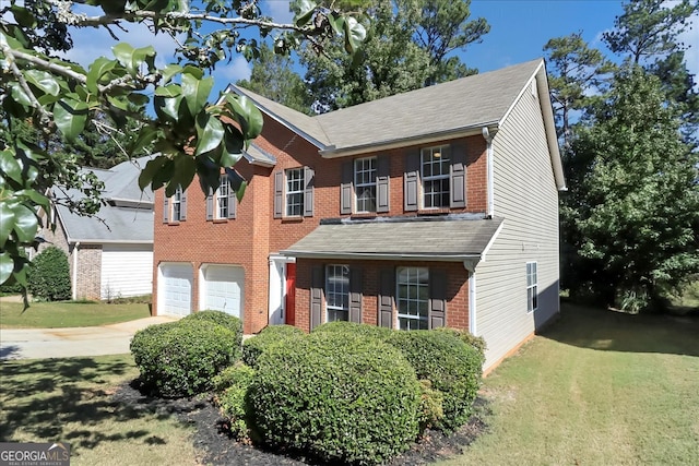 colonial house with a front lawn and a garage