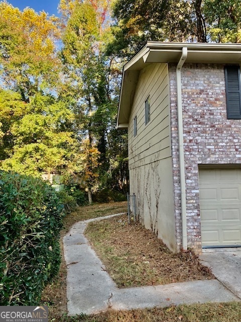 view of property exterior featuring a garage