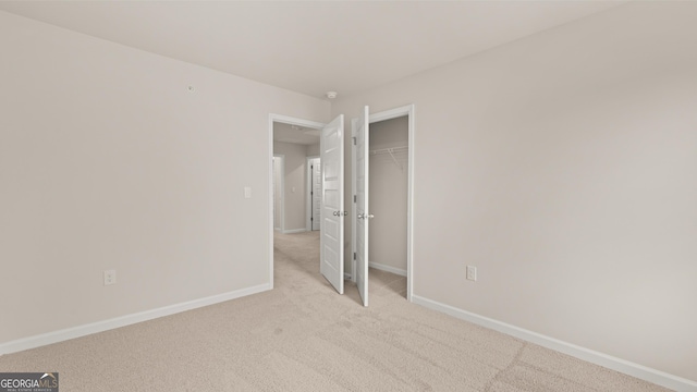 353 Sound Cir, Stockbridge, GA 30281 - hall featuring an upstairs landing, baseboards, light colored carpet, and recessed lighting
