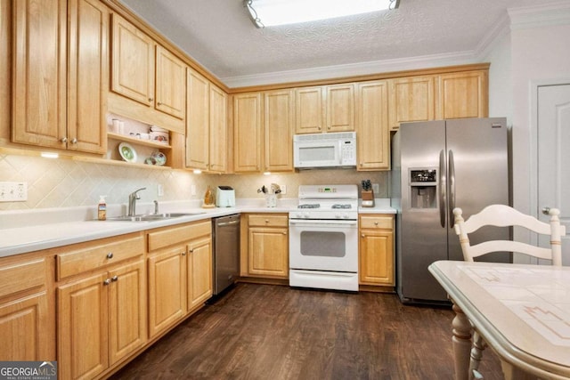 kitchen featuring sink, a textured ceiling, dark hardwood / wood-style flooring, stainless steel appliances, and ornamental molding