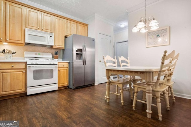 kitchen with backsplash, dark hardwood / wood-style floors, a notable chandelier, decorative light fixtures, and white appliances