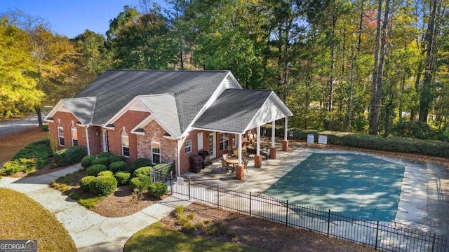 view of swimming pool with a patio