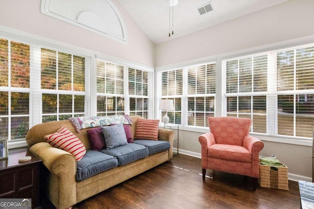 sunroom with ceiling fan, lofted ceiling, and plenty of natural light