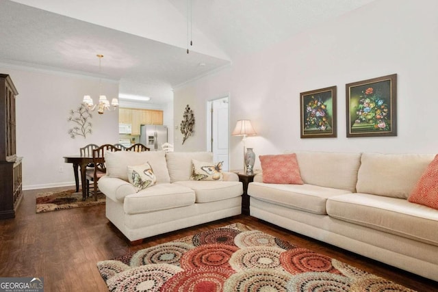 living room with dark wood-type flooring, vaulted ceiling, ornamental molding, and an inviting chandelier