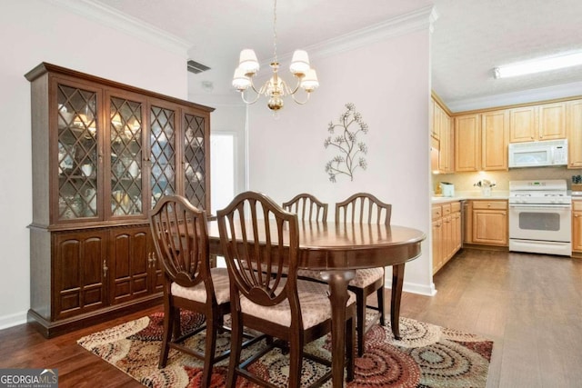 dining room with crown molding, a notable chandelier, and dark wood-type flooring