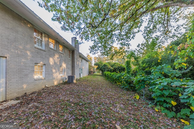 view of yard featuring central AC