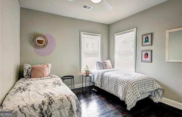 bedroom featuring dark hardwood / wood-style floors and ceiling fan