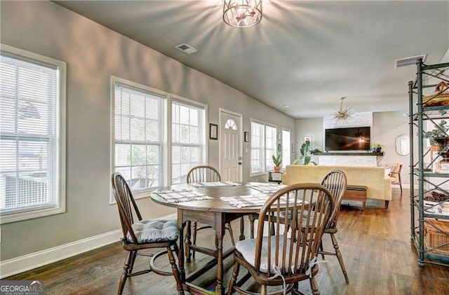 dining room with dark hardwood / wood-style floors