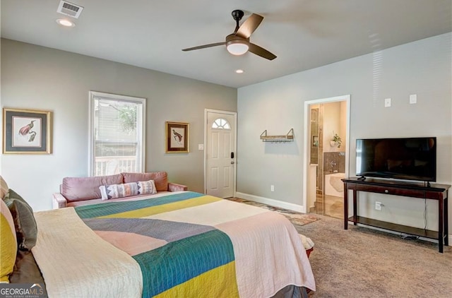 carpeted bedroom featuring ensuite bathroom and ceiling fan