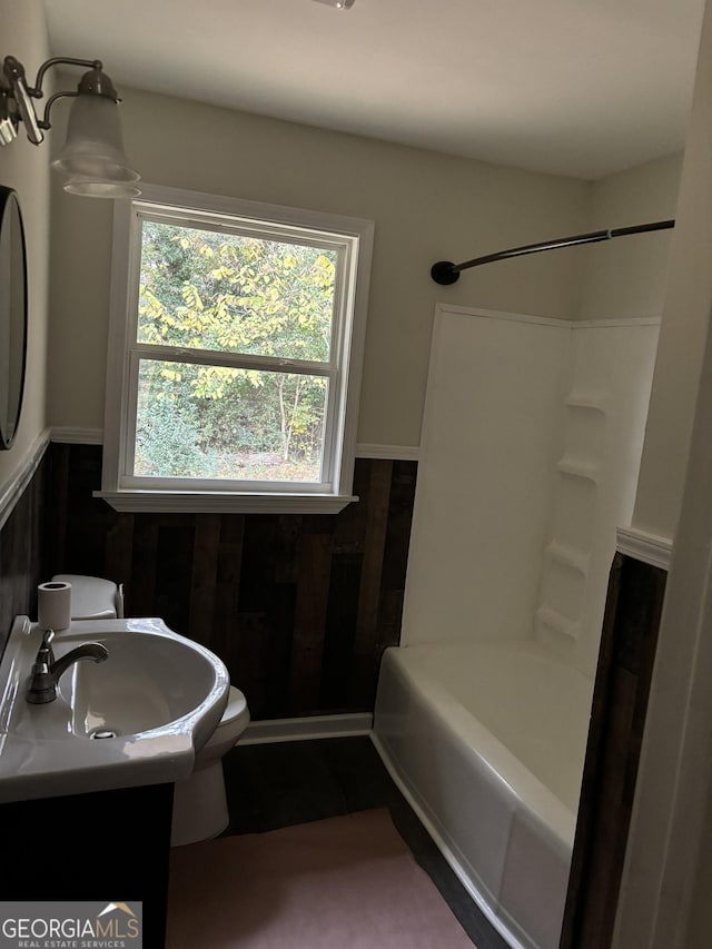 full bathroom with shower / bathtub combination, toilet, and vanity