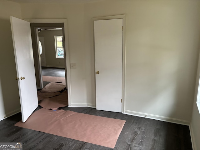 bedroom featuring dark wood-type flooring