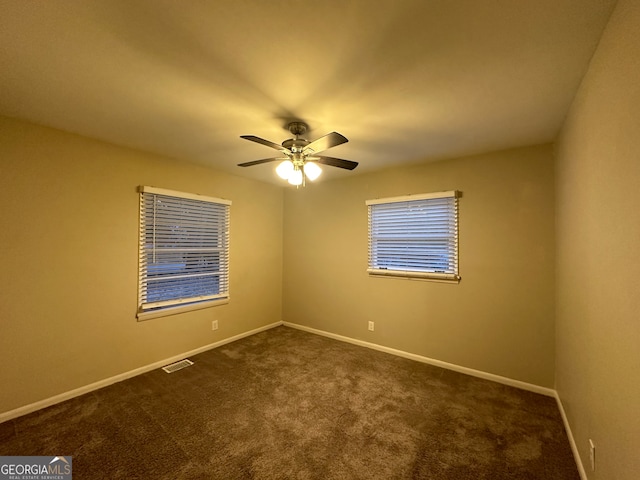 carpeted empty room with ceiling fan