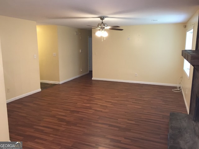 unfurnished room with dark hardwood / wood-style floors and ceiling fan