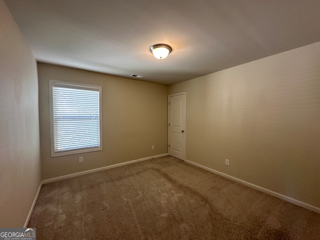 unfurnished room with carpet