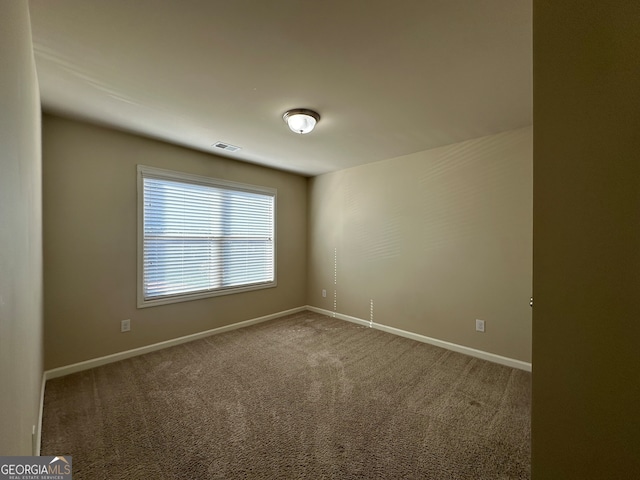 view of carpeted spare room