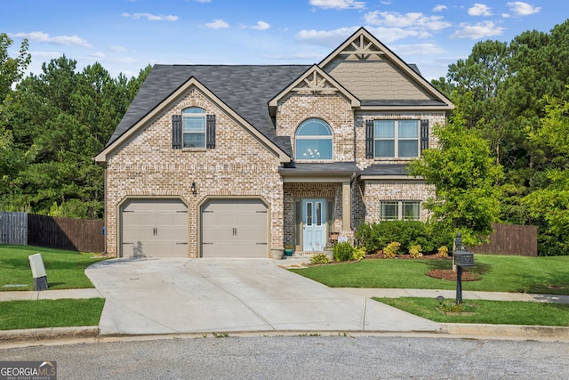 craftsman house with a garage and a front lawn