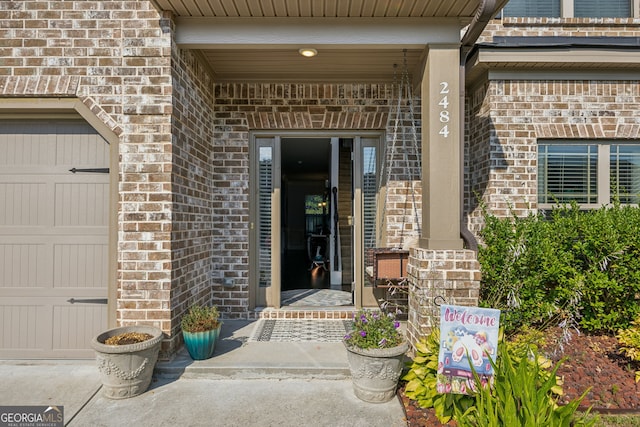 view of exterior entry featuring a garage