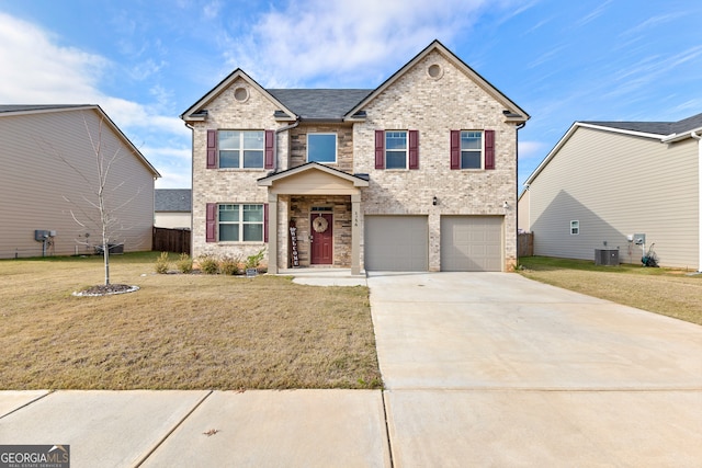 view of front facade with cooling unit, a garage, and a front lawn