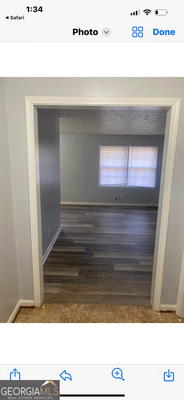 hall featuring dark wood-type flooring