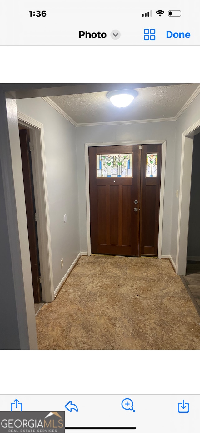 entrance foyer with crown molding