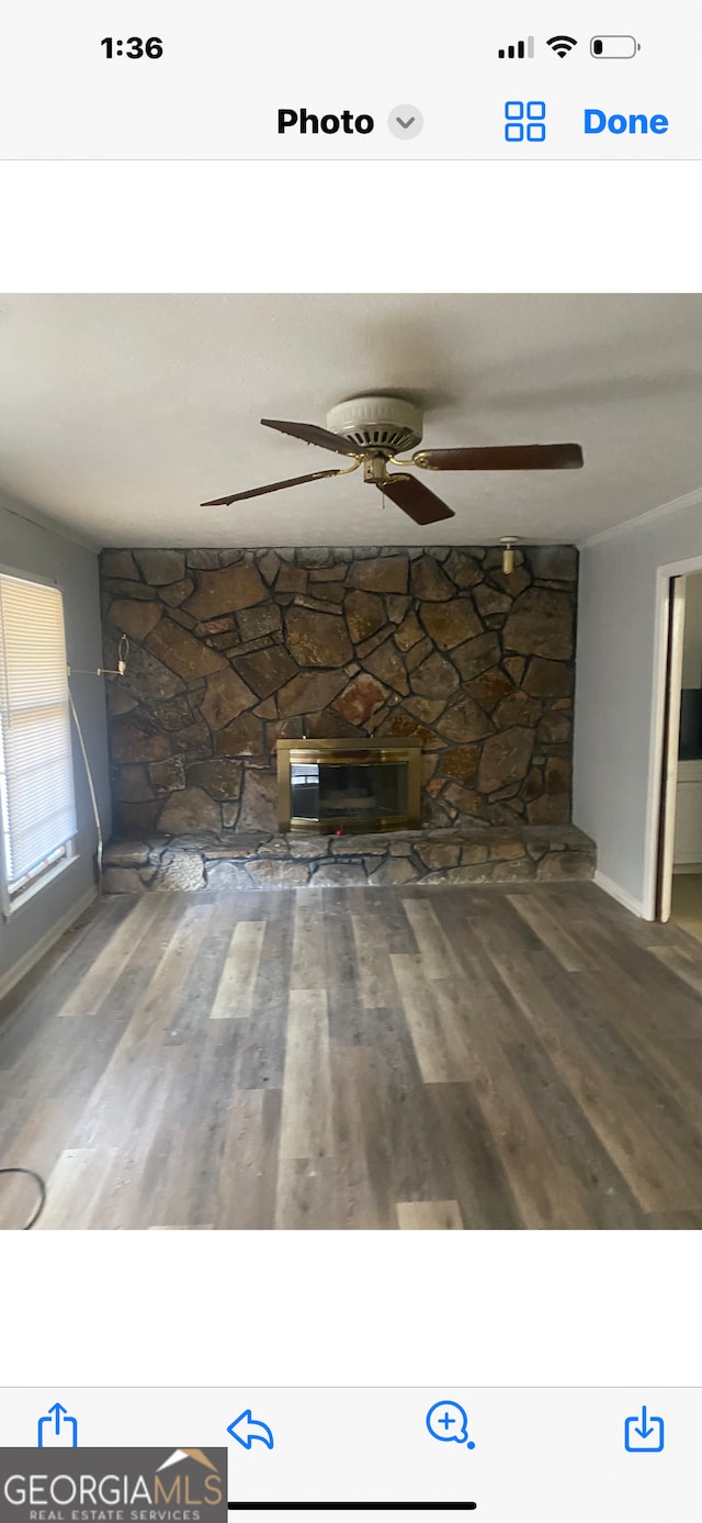 interior space with ceiling fan and hardwood / wood-style flooring