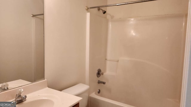 full bathroom featuring vanity, bathing tub / shower combination, and toilet