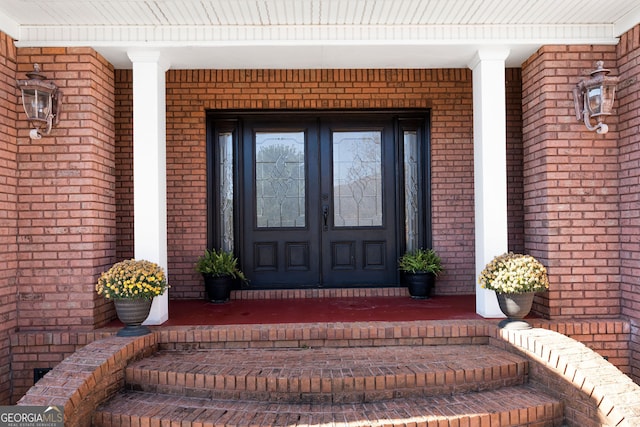 property entrance featuring covered porch