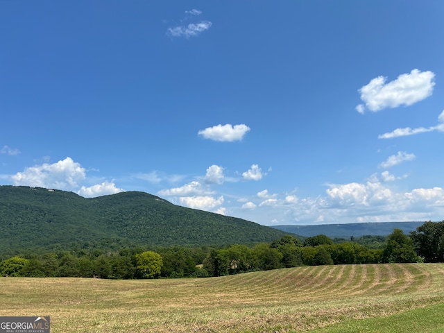 property view of mountains featuring a rural view