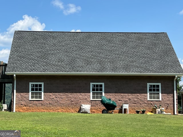 view of home's exterior with a yard