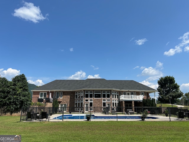 view of pool featuring a yard and a patio