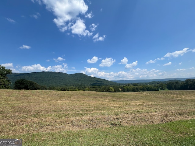 mountain view featuring a rural view