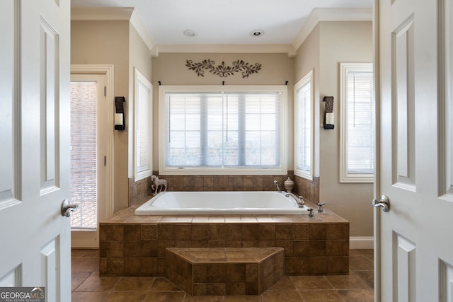 bathroom with ornamental molding, tile patterned flooring, tiled tub, and plenty of natural light