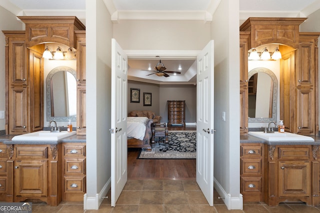 bathroom with hardwood / wood-style floors, vanity, crown molding, and ceiling fan