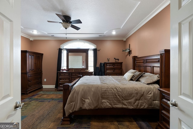 bedroom with crown molding, a textured ceiling, and ceiling fan