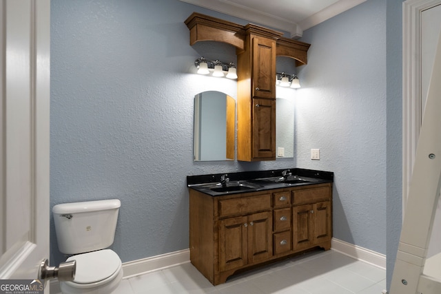 bathroom with vanity, ornamental molding, toilet, and tile patterned floors