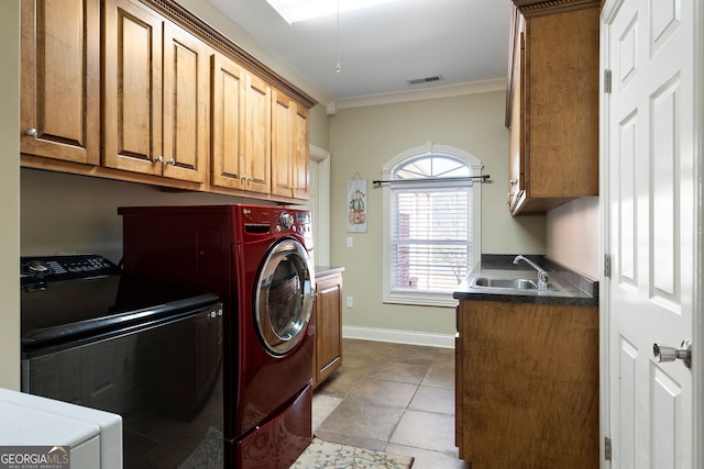 washroom with light tile patterned floors, sink, independent washer and dryer, ornamental molding, and cabinets