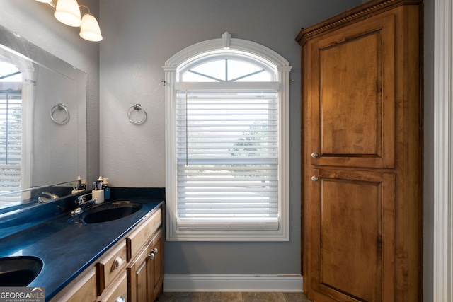 bathroom with vanity and tile patterned flooring