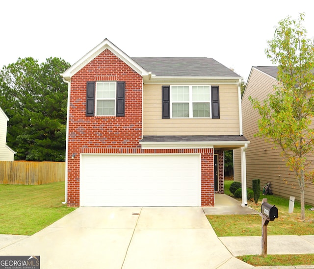 view of front of house featuring a front yard and a garage