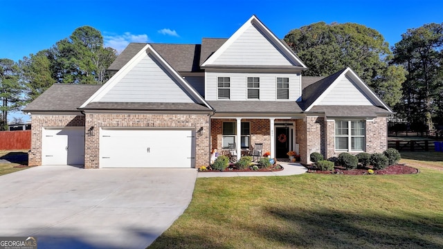 view of front of home featuring a garage and a front yard