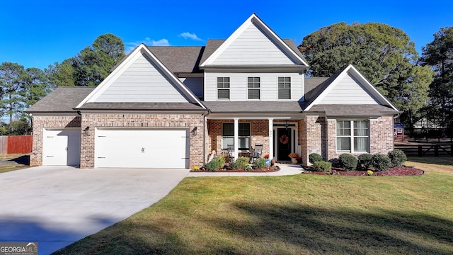 view of front of house with a front yard and a garage