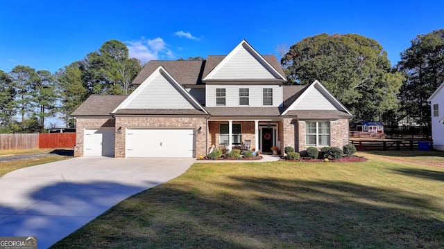 view of front of home with a front lawn and a garage