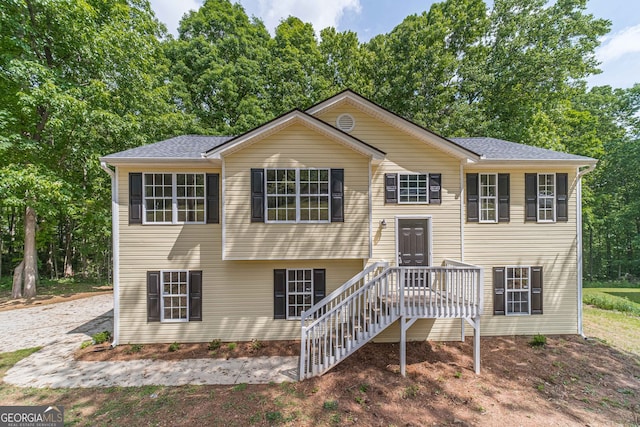 split foyer home featuring a wooden deck