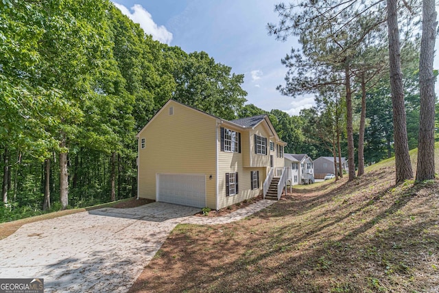 view of side of property featuring a garage