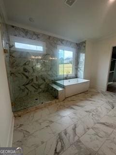 bathroom featuring a stall shower, marble finish floor, visible vents, and a freestanding bath