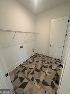 laundry room featuring laundry area, hookup for a washing machine, and baseboards