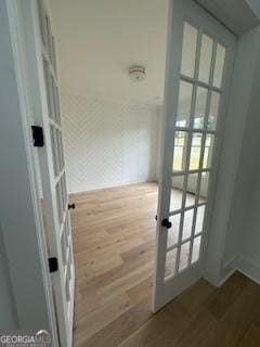 doorway with french doors and wood finished floors